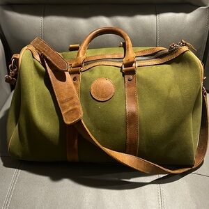 Weekend bag. good condition, lots of trips still left in it. Real leather trim.